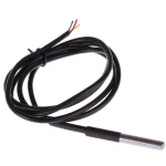 Sammenrullet temperaturf�ler med kabel og metalspids p� hvid baggrund